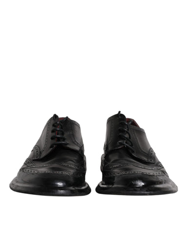 Black leather Derby wingtip formal shoes by Dolce & Gabbana, featuring detailed brogue design and polished finish.