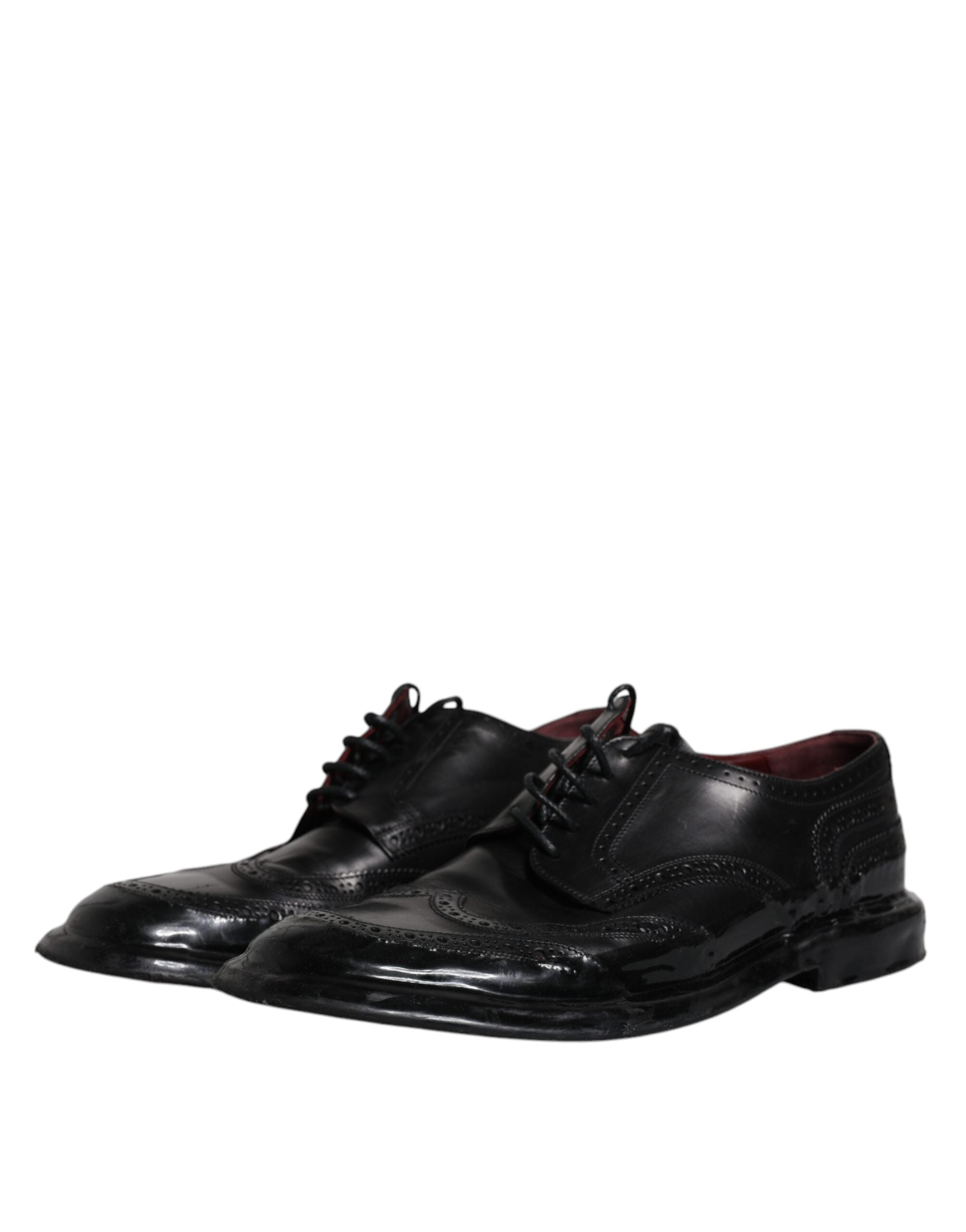 Black leather Derby wingtip formal shoes by Dolce & Gabbana, showing detailed brogue design and polished finish.