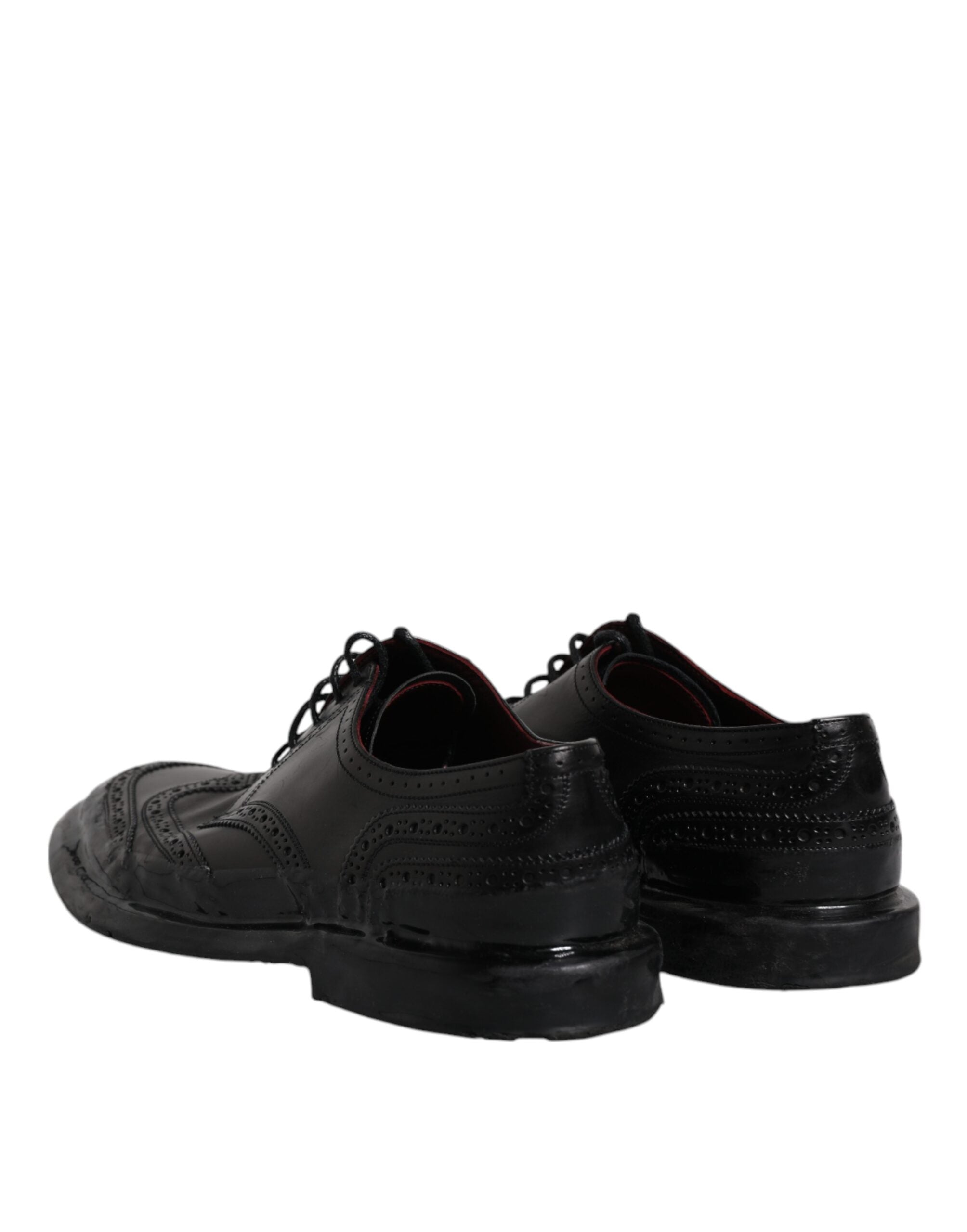 Dolce & Gabbana black leather derby wingtip formal shoes with brogue detailing and polished finish.