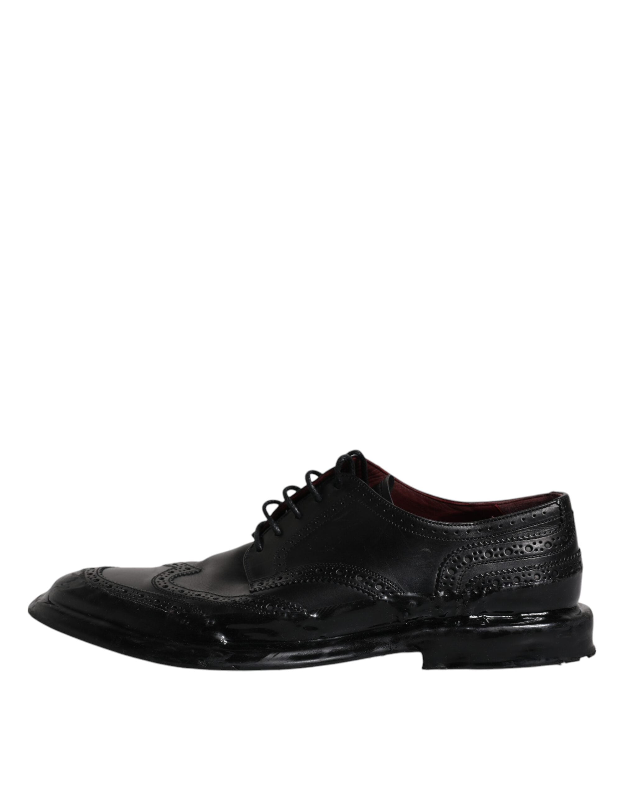 Dolce & Gabbana black leather derby wingtip formal shoes with brogue detailing and classic lace-up design.