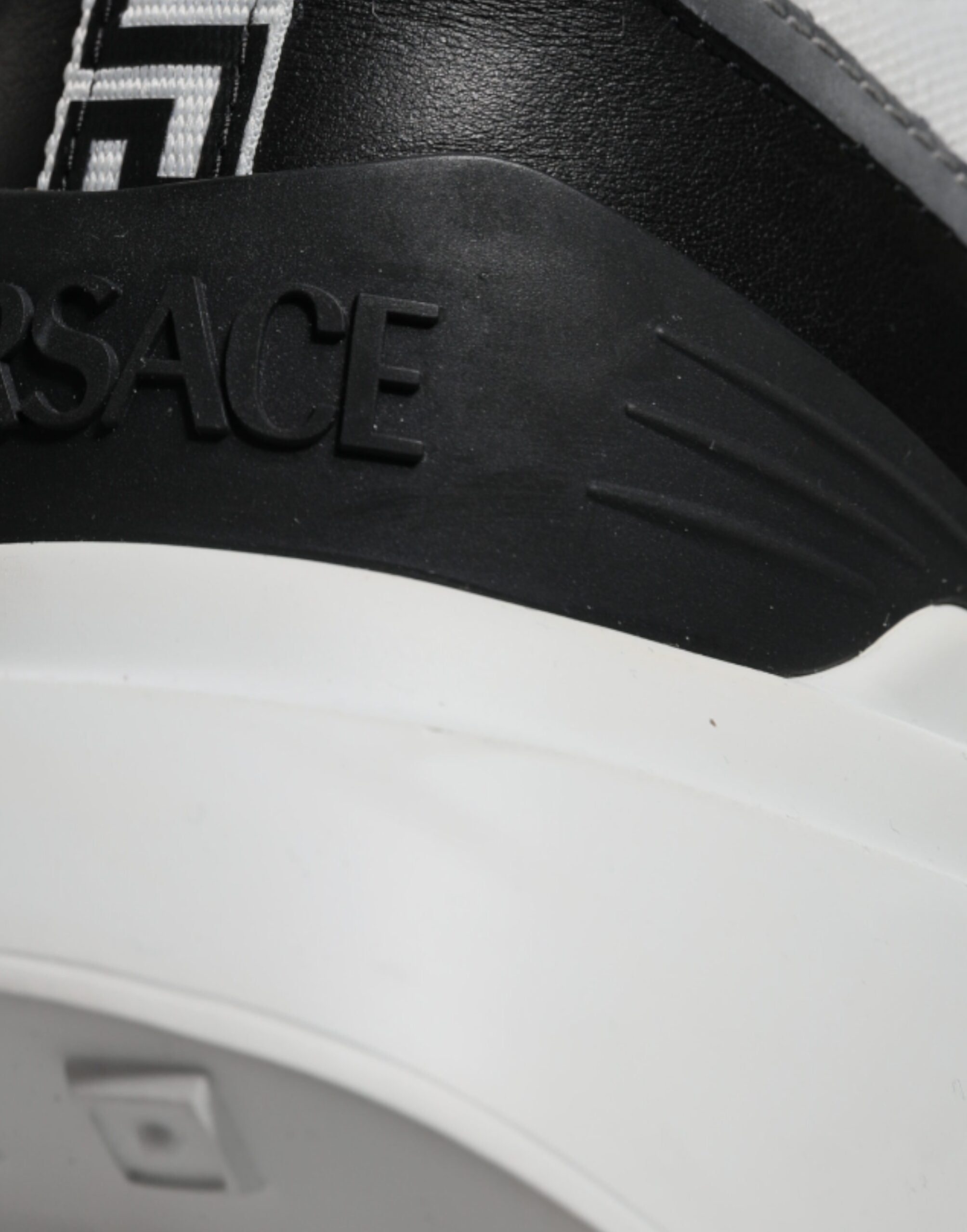 Versace multicolor canvas low top sneakers with Medusa logo and quad fabric design, stylish and vibrant casual shoes.