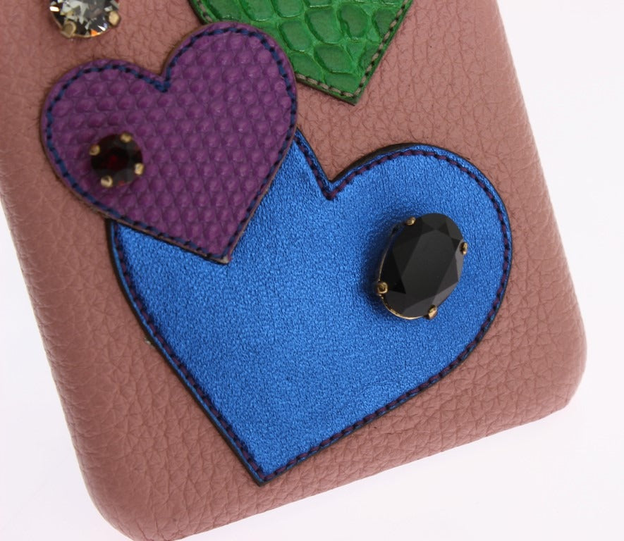 Pink leather phone case with heart-shaped crystal embellishments, designed by Dolce & Gabbana.