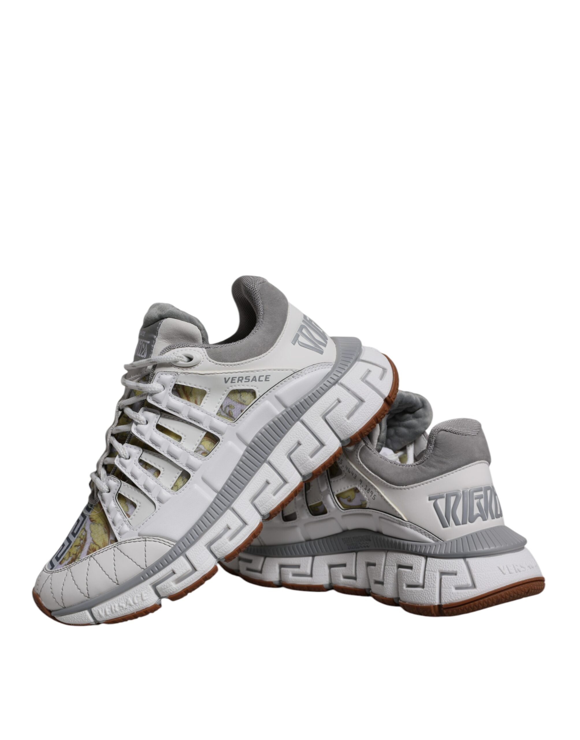 White Versace Trigreca Barocco print low-top sneakers with bold logo design and stylish comfort.
