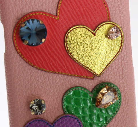 Pink leather phone case with heart-shaped crystal embellishments for iPhone, designed by Dolce & Gabbana.