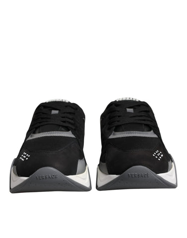 Versace Black leather and neoprene chunky low-top sneakers with thick soles and stylish design.