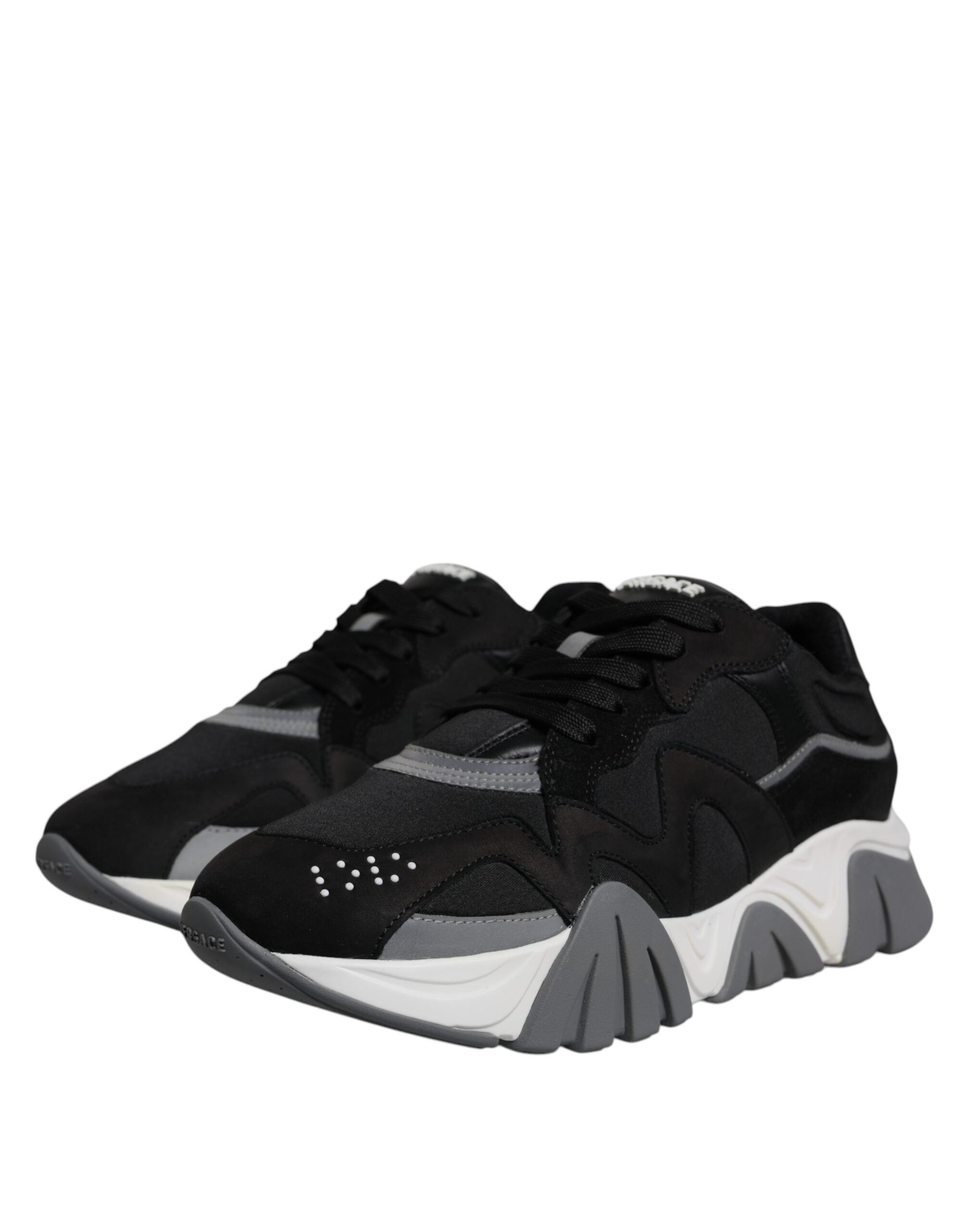 Versace Black leather and neoprene chunky low-top sneakers with thick soles and lace-up design.
