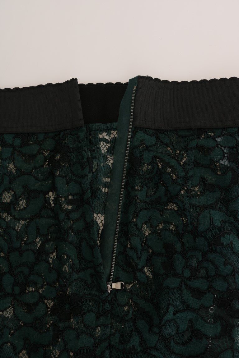 Green floral lace leggings from Dolce & Gabbana with intricate lace pattern, fitted style, and floral detailing.