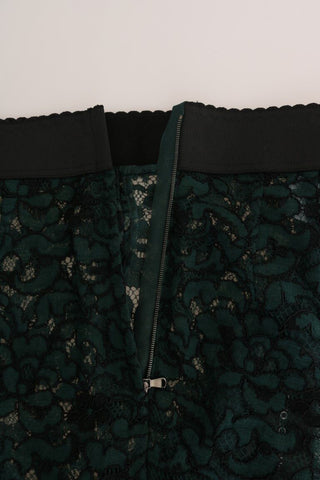 Green floral lace leggings from Dolce & Gabbana with intricate lace pattern, fitted style, and floral detailing.