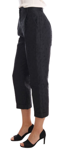 Black floral brocade Capri pants by Dolce & Gabbana, showcasing detailed floral pattern and stylish cropped fit.