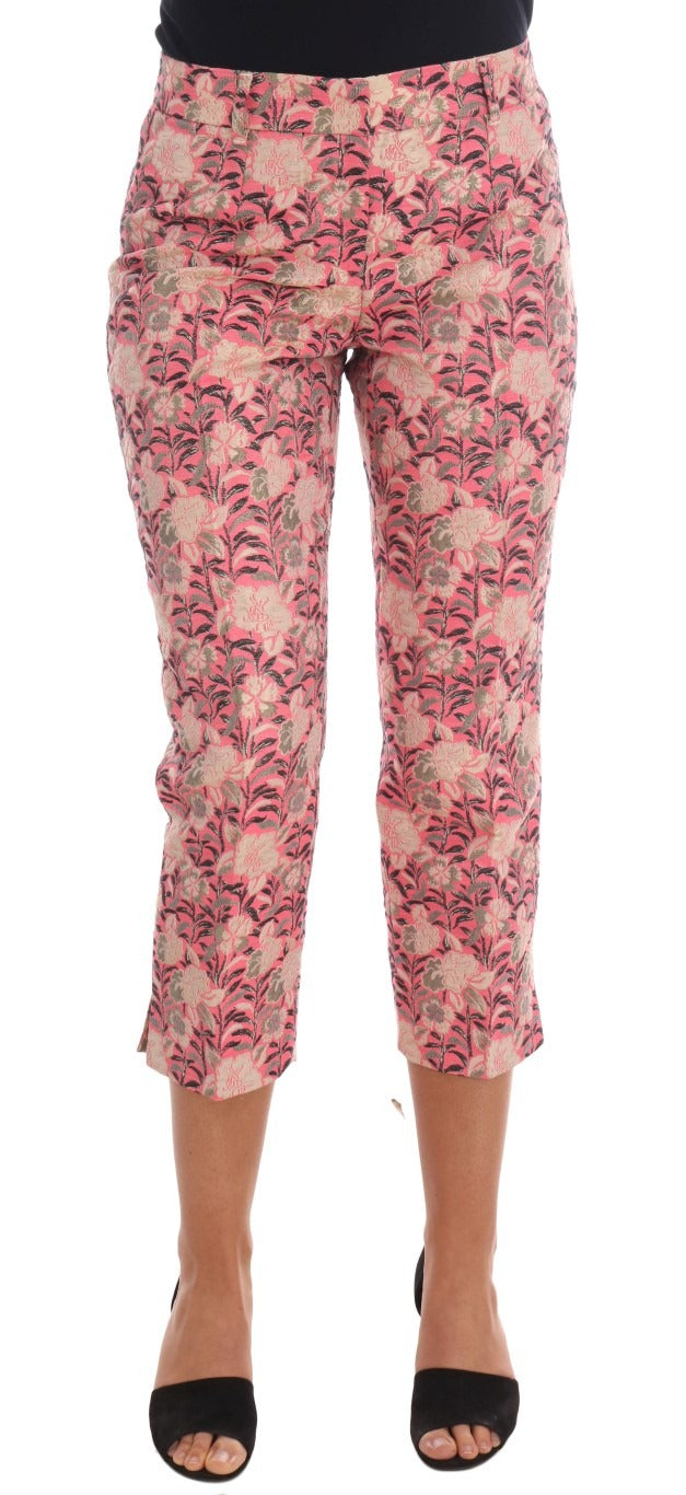 Pink floral brocade Capri pants by Dolce & Gabbana displayed on a model, showcasing intricate floral patterns and luxurious fabric.