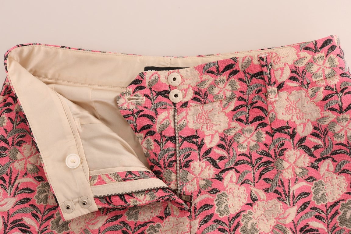 Pink floral brocade Capri pants by Dolce & Gabbana, showcasing intricate floral pattern and tailored fit.