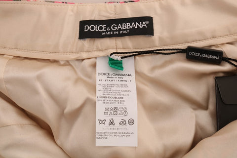Pink floral brocade Capri pants by Dolce & Gabbana with intricate floral patterns and tailored fit.