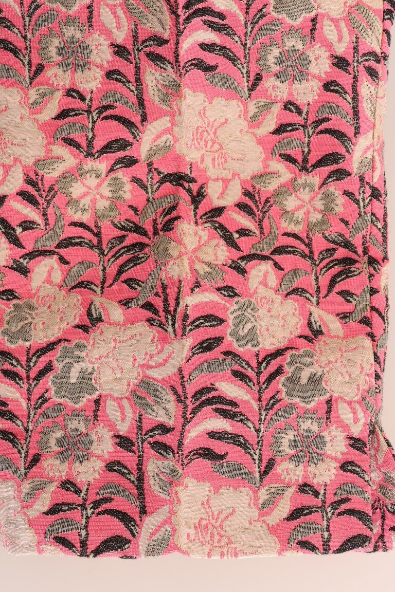 Pink floral brocade Capri pants by Dolce & Gabbana, featuring intricate floral pattern and tailored fit.