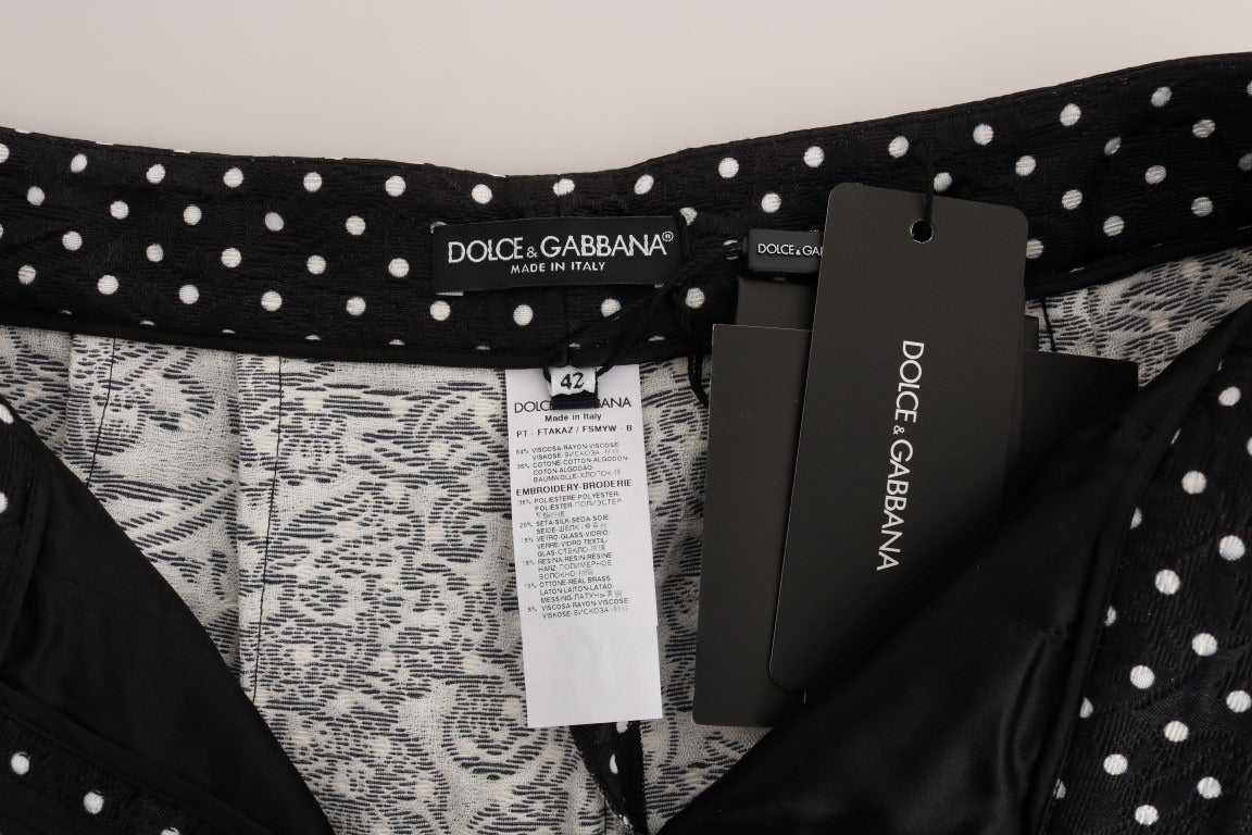 Black polka dot Sicily crystal pants by Dolce & Gabbana displayed on a model against a plain background.