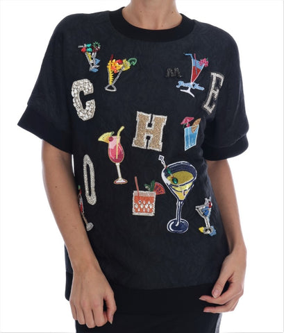 Black brocade cocktail sweater with crystal embellishments by Dolce & Gabbana, featuring intricate pattern and elegant design.