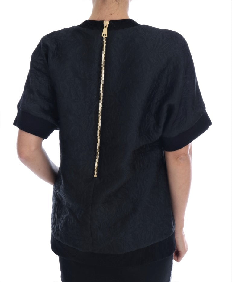 Black brocade cocktail sweater with crystal embellishments from Dolce & Gabbana, featuring intricate fabric details and elegant design.