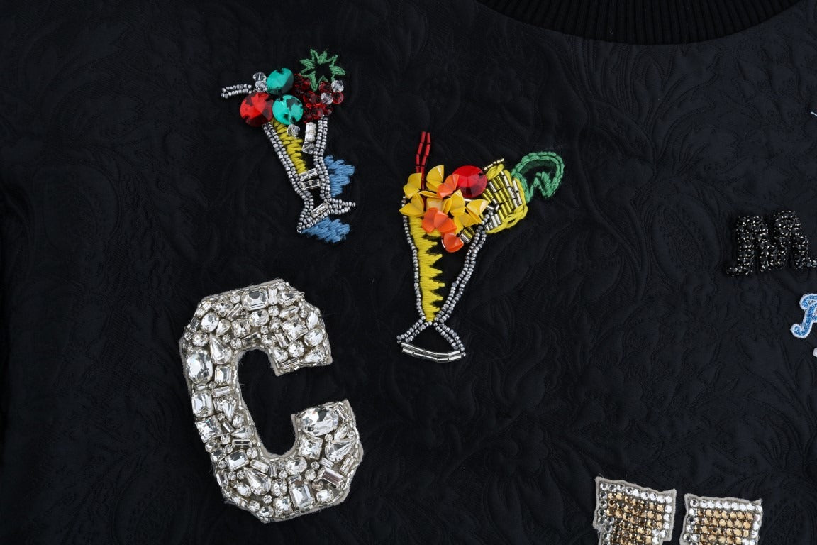 Black brocade cocktail sweater with crystal embellishments by Dolce & Gabbana, displayed on a mannequin.