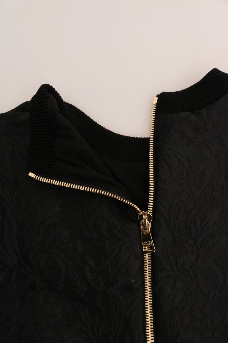 Black brocade Dolce & Gabbana cocktail sweater with crystal embellishments, showcasing intricate fabric and elegant design.