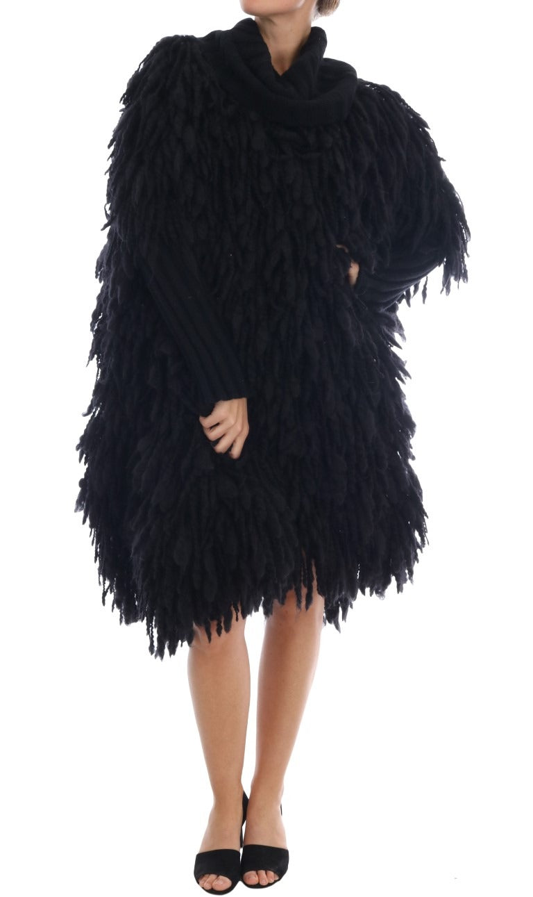 Black fringes wool pullover sweater by Dolce & Gabbana featuring a cozy knit with stylish fringe details.