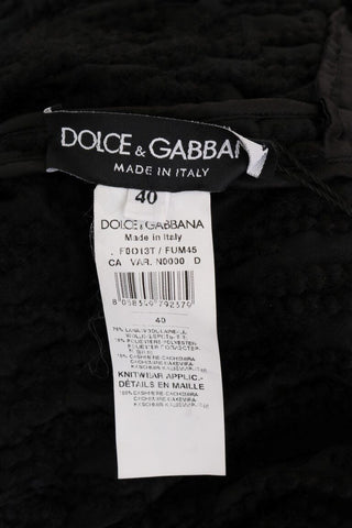 Dolce & Gabbana black wool pullover sweater with stylish fringes, showcasing a cozy knit design and textured details.