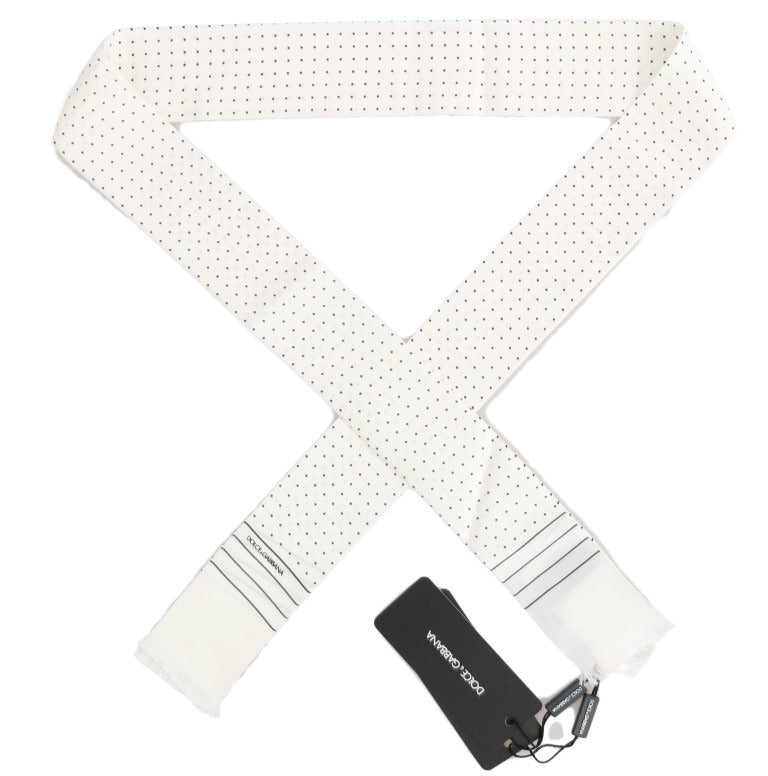 White silk skinny scarf with black polka dots by Dolce & Gabbana, featuring a lightweight, smooth fabric with a stylish, narrow design.