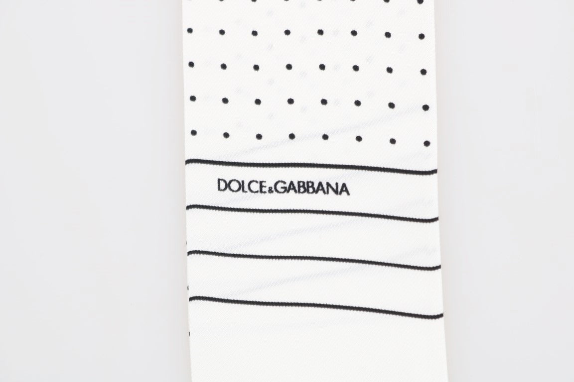 White silk skinny scarf with black polka dots by Dolce & Gabbana, featuring a lightweight, smooth fabric and classic pattern.