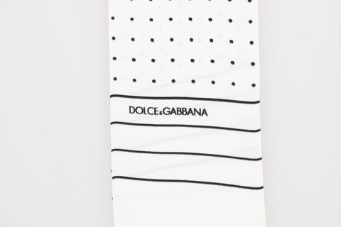 White silk skinny scarf with black polka dots by Dolce & Gabbana, featuring a lightweight, smooth fabric and classic pattern.