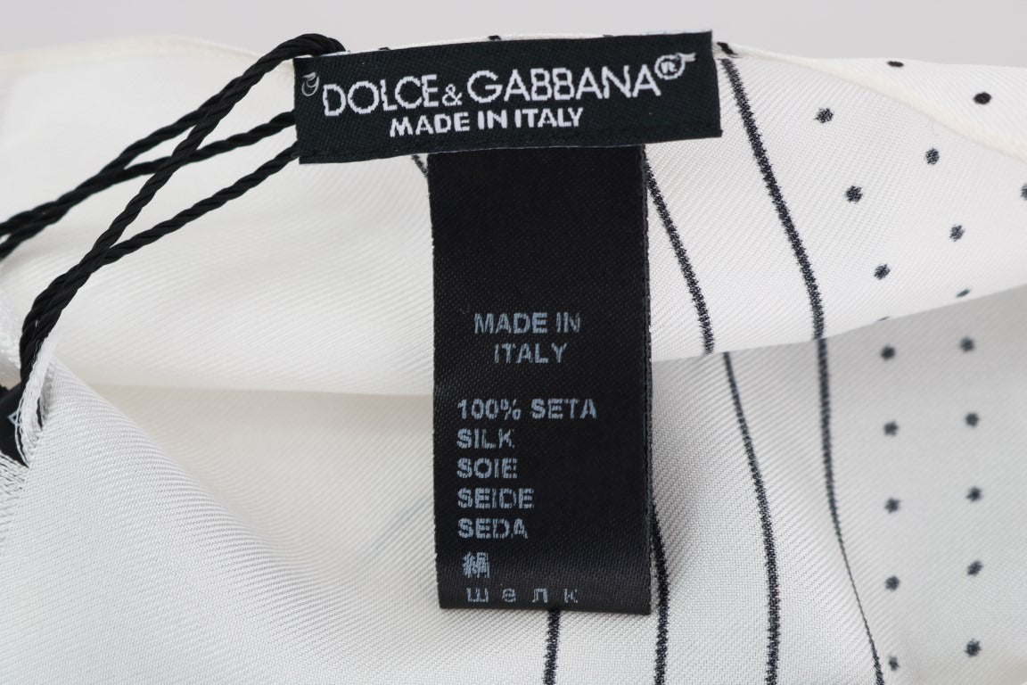 White silk skinny scarf with black polka dots by Dolce & Gabbana, featuring a lightweight, smooth fabric and classic pattern.