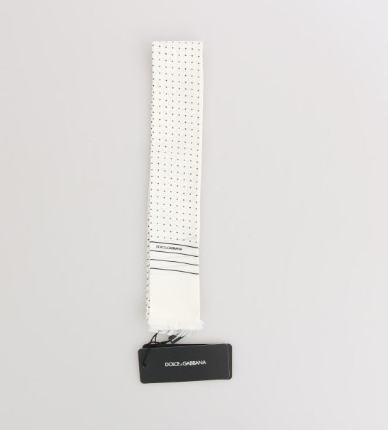 White silk skinny scarf with black polka dots by Dolce & Gabbana, featuring a lightweight, smooth fabric and stylish pattern.