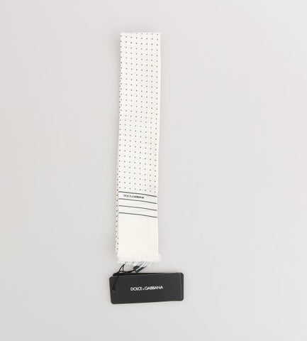 White silk skinny scarf with black polka dots by Dolce & Gabbana, featuring a lightweight, smooth fabric and stylish pattern.