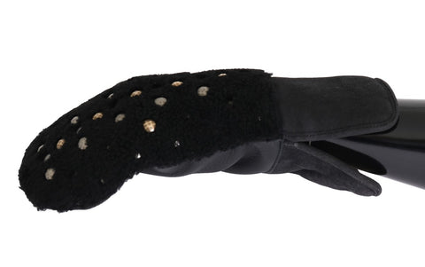 Black leather shearling gloves with studded details by Dolce & Gabbana, showing close-up of textured leather and metal studs.