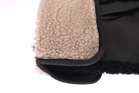 Black leather shearling gloves with studded accents by Dolce & Gabbana, showing detailed stitching and texture.