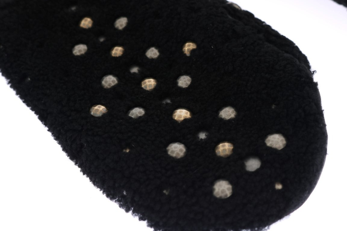 Black leather shearling studded gloves by Dolce & Gabbana, featuring a stylish design with metal stud accents and cozy shearling lining.
