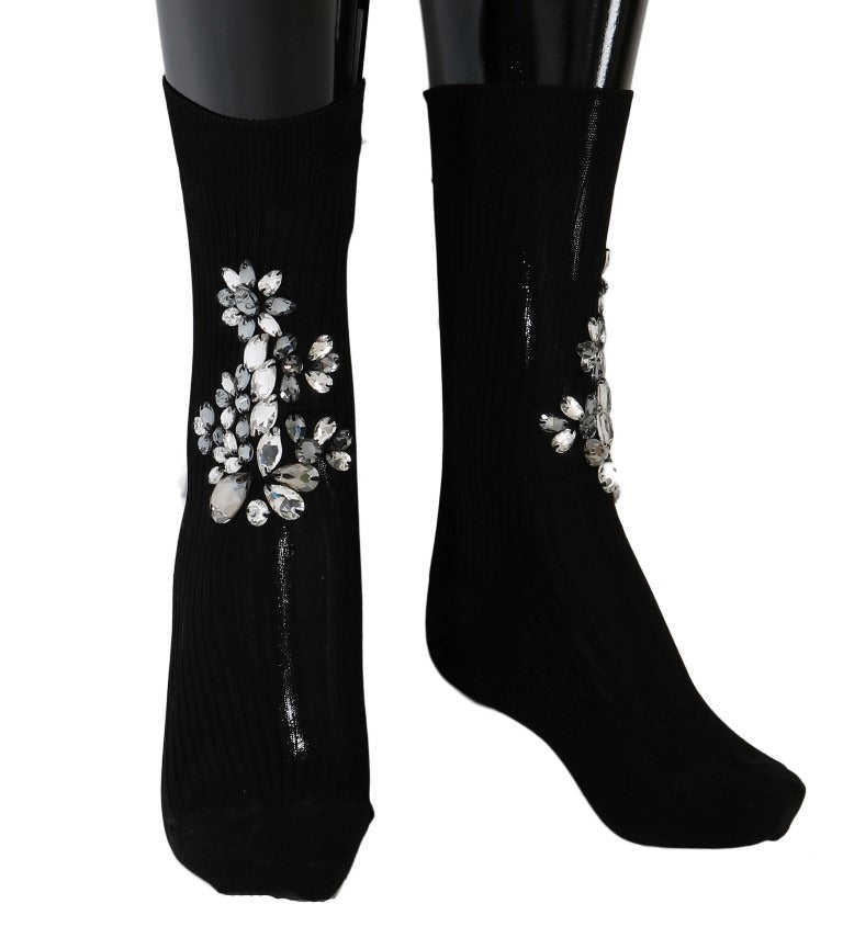 Black knitted floral socks with clear crystal embellishments from Dolce & Gabbana, featuring intricate floral patterns and elegant design.