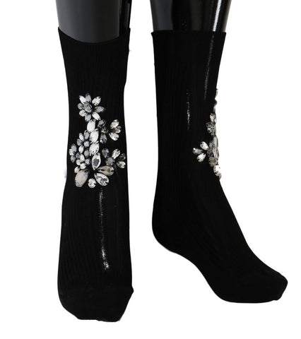 Black knitted floral socks with clear crystal embellishments from Dolce & Gabbana, featuring intricate floral patterns and elegant design.