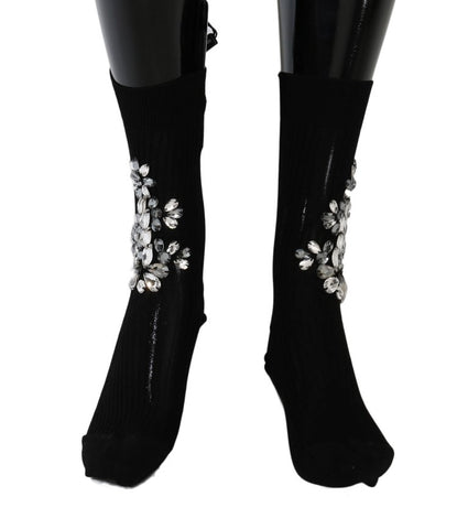 Black knitted floral socks with clear crystal accents by Dolce & Gabbana, featuring intricate floral patterns and transparent embellishments.