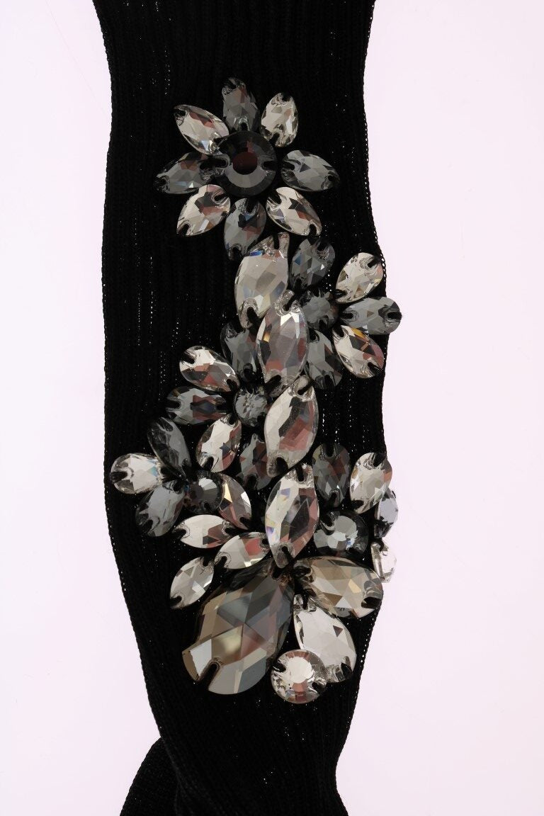 Black knitted floral socks with clear crystals from Dolce & Gabbana, featuring intricate floral patterns and a textured knit design.