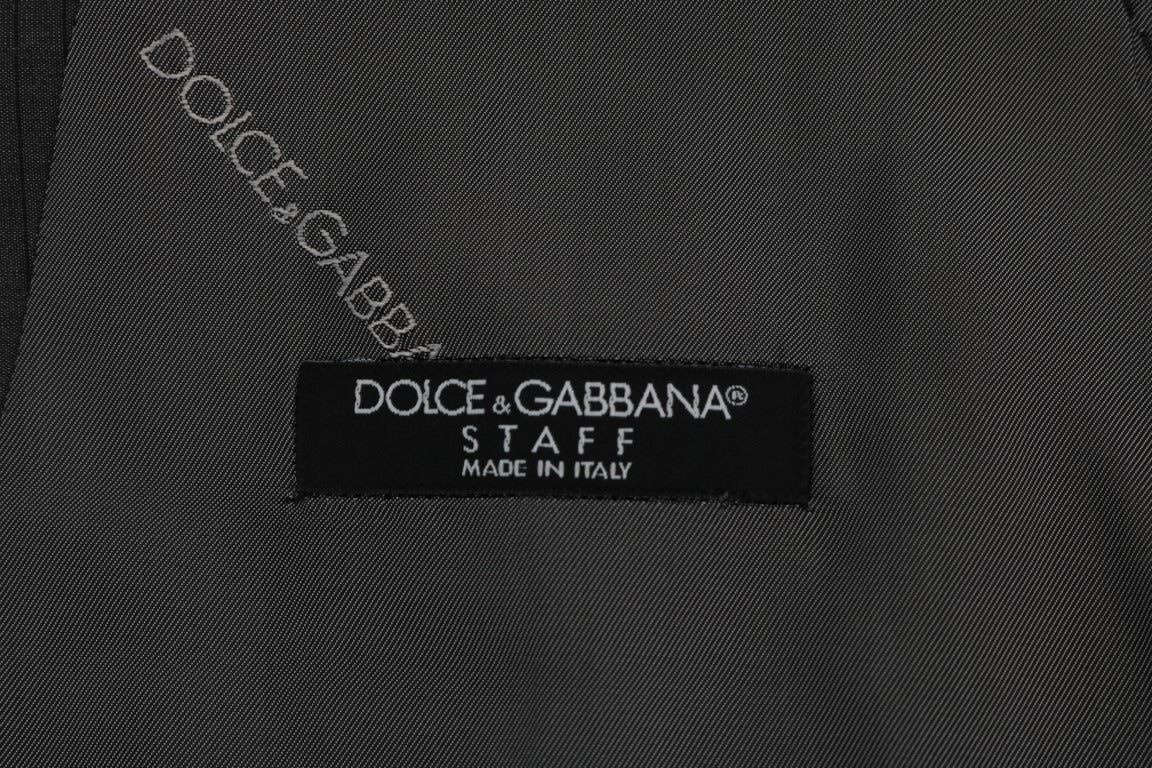 Gray STAFF cotton rayon vest by Dolce & Gabbana, shown on a hanger with a close-up of fabric texture and tailored fit.