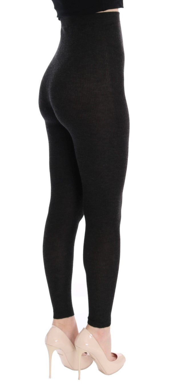 Gray cashmere stretch tights by Dolce & Gabbana, close-up of soft, fitted knit fabric with waistband detail.