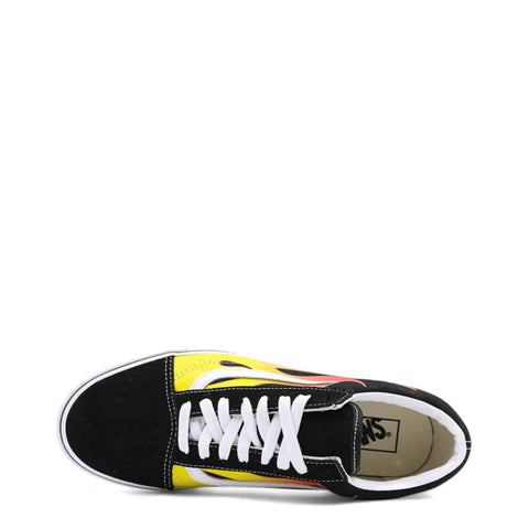 Vans Old-Skool sneakers in classic black and white, featuring signature side stripe, displayed in a casual setting.