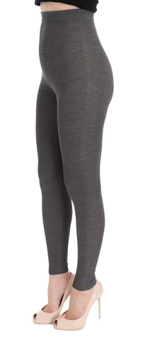 Gray cashmere stretch tights by Dolce & Gabbana, close-up showing soft fabric and fitted design on model's legs.