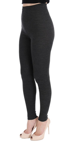 Gray wool stretch tights by Dolce & Gabbana, close-up of fabric texture and fit on model's legs.