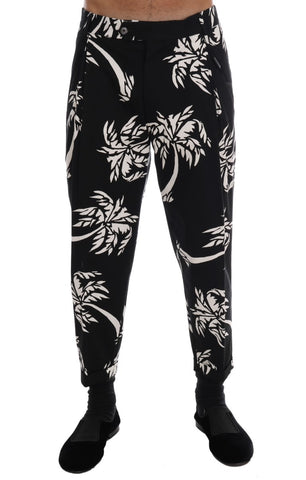 Black cotton stretch pants from Dolce & Gabbana featuring a tailored fit and sleek style, shown on a model.