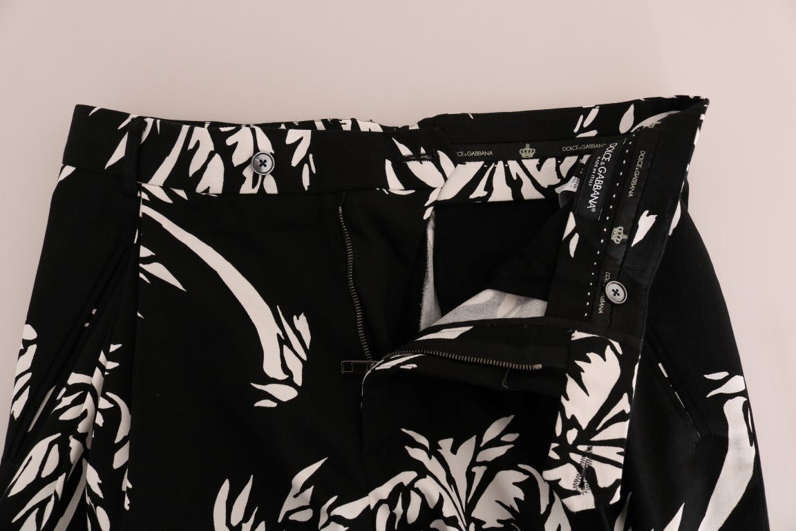Black cotton stretch pants by Dolce & Gabbana featuring a sleek fit and tree-inspired design details.