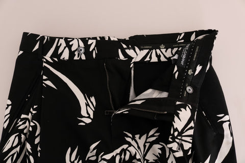 Black cotton stretch pants by Dolce & Gabbana featuring a sleek fit and tree-inspired design details.