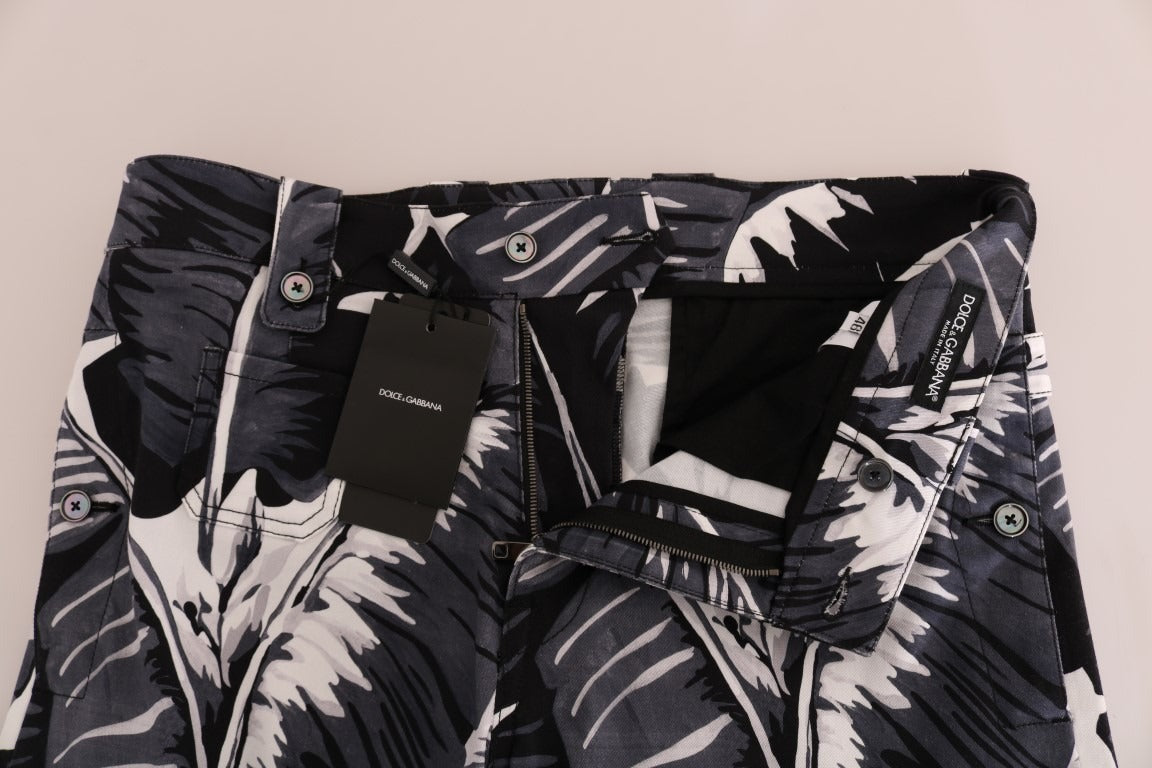 Gray banana leaf cotton pants by Dolce & Gabbana with a relaxed fit and tropical print, displayed on a model.