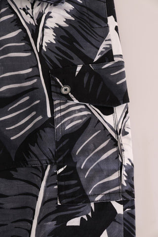 Gray Dolce & Gabbana banana leaf cotton pants displayed with a focus on the relaxed fit and tropical leaf print fabric.