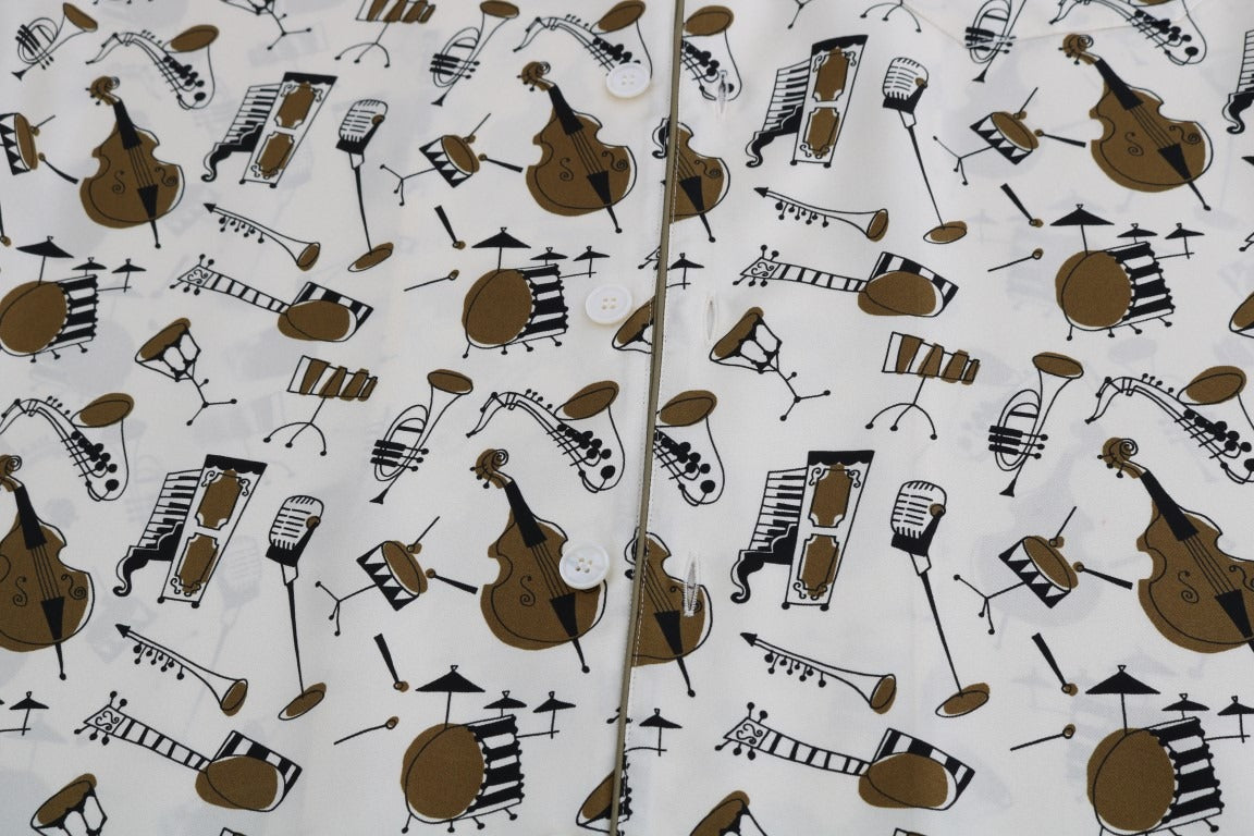 White silk Jazz Motive print shirt by Dolce & Gabbana, featuring a stylish pattern and classic collar in a close-up view.
