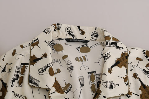 White silk jazz motive print shirt by Dolce & Gabbana featuring a stylish pattern and elegant design.