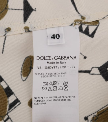 White silk shirt with jazz motive print by Dolce & Gabbana, featuring a classic fit and elegant design.